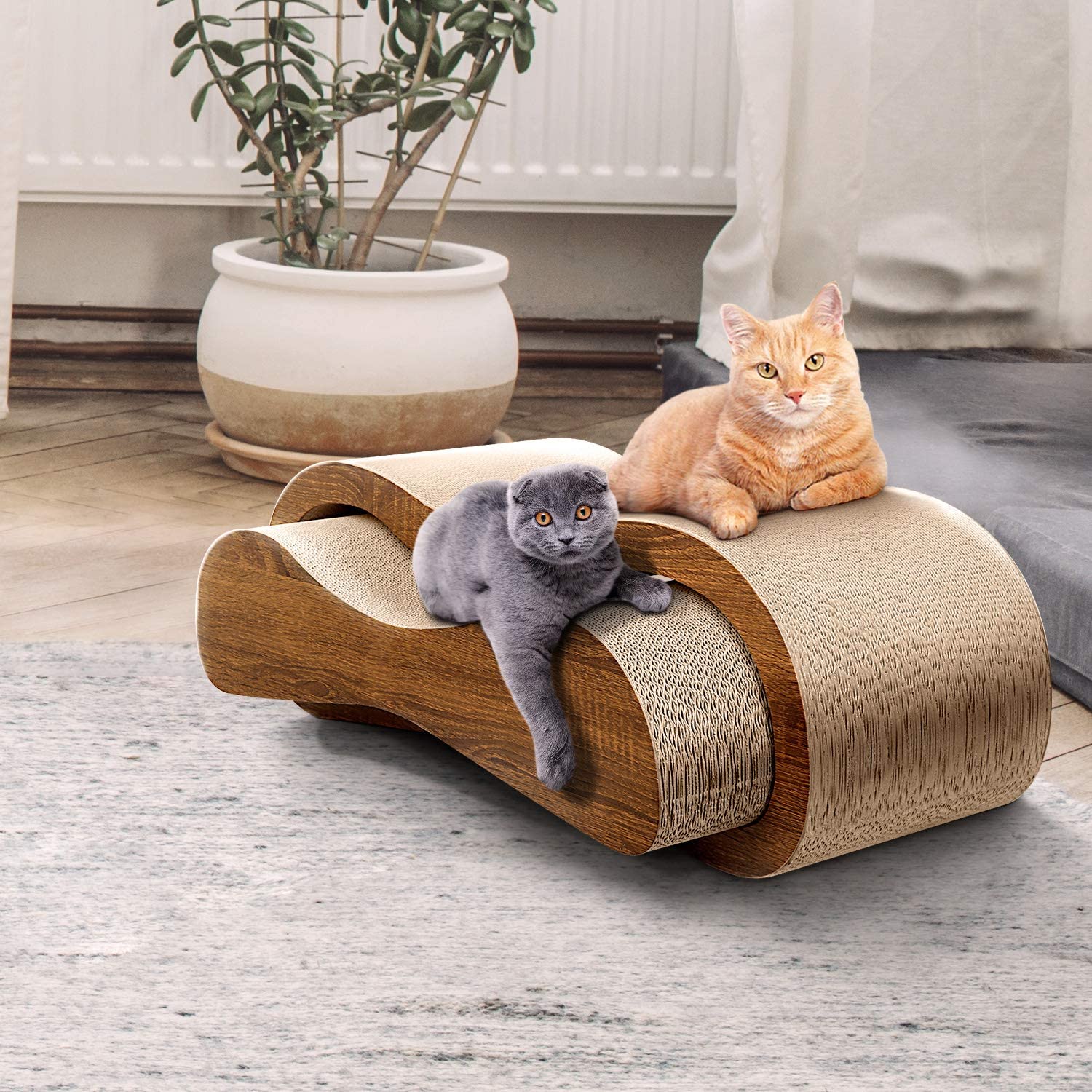 Two cats relax on a durable 2-in-1 cat scratcher lounge, designed for comfort and play while protecting furniture.